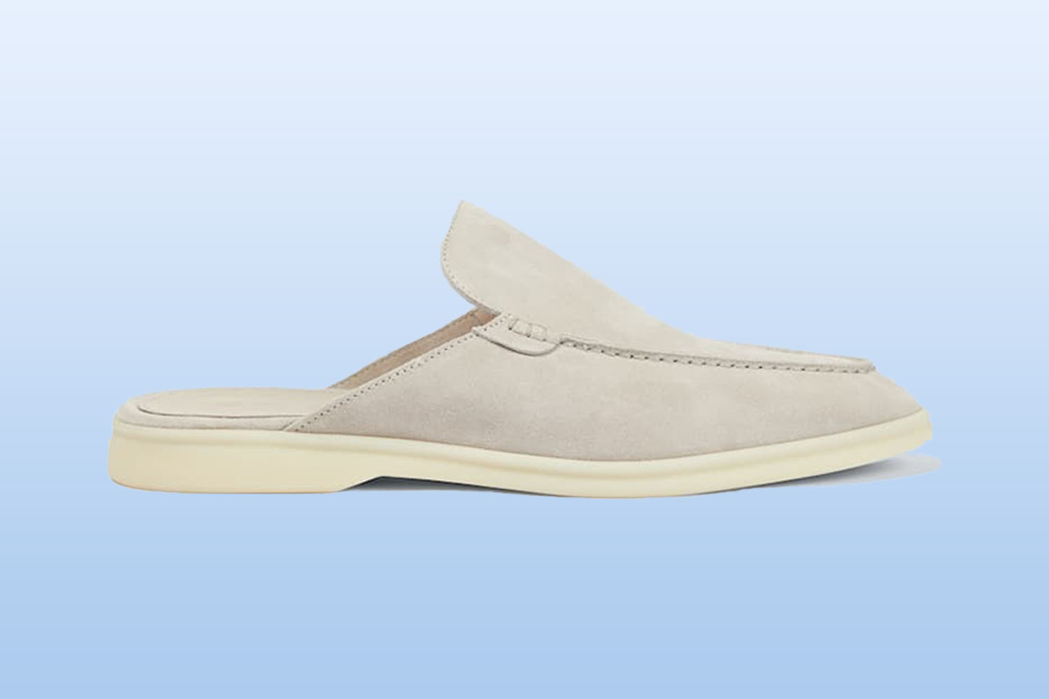 a suede backless loafer from mytheresa on a light blue background