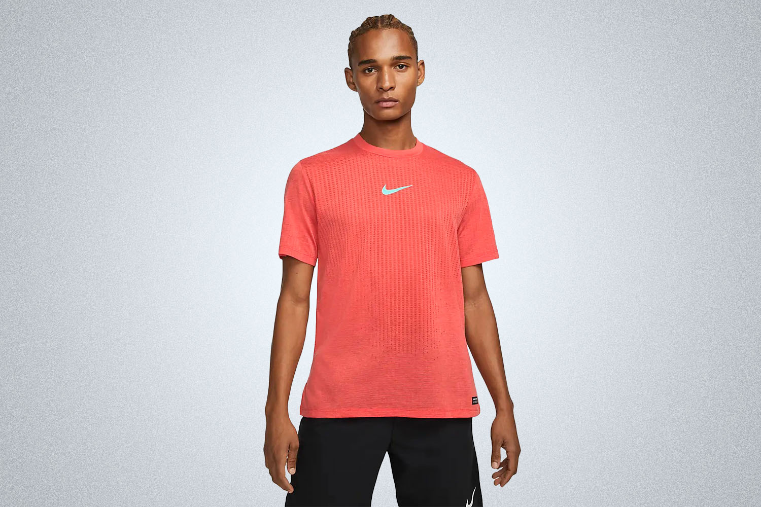 a red nike tee on a grey background