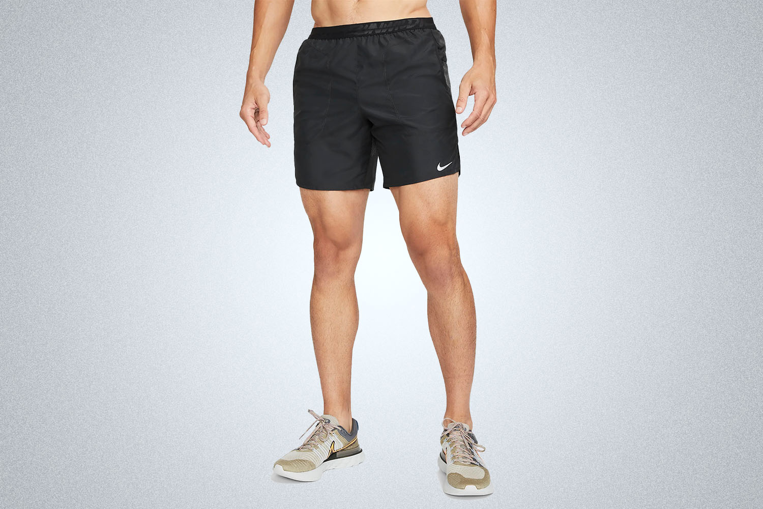 a pair of nike shorts on a grey background