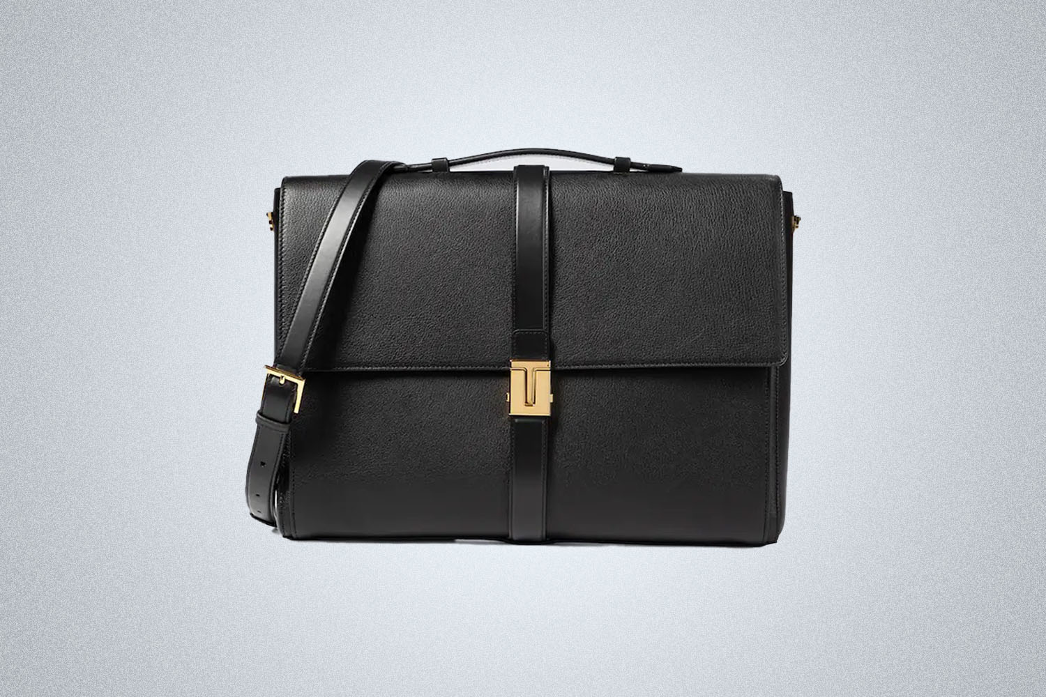 a black leather briefcase from Tom Ford on a grey background