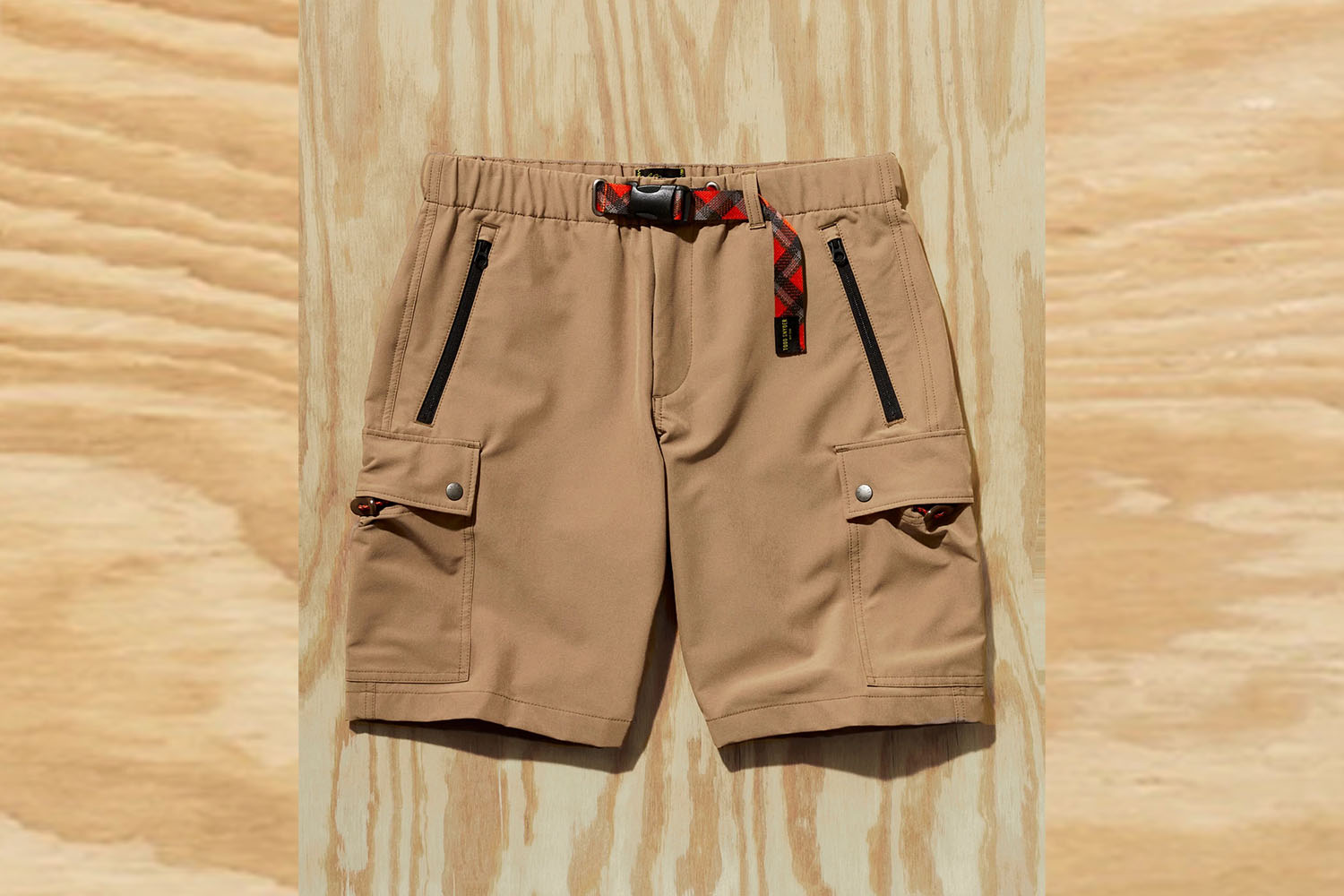 a Todd Snyder x L.L. Bean pair of Climbing Shorts on a wooden background