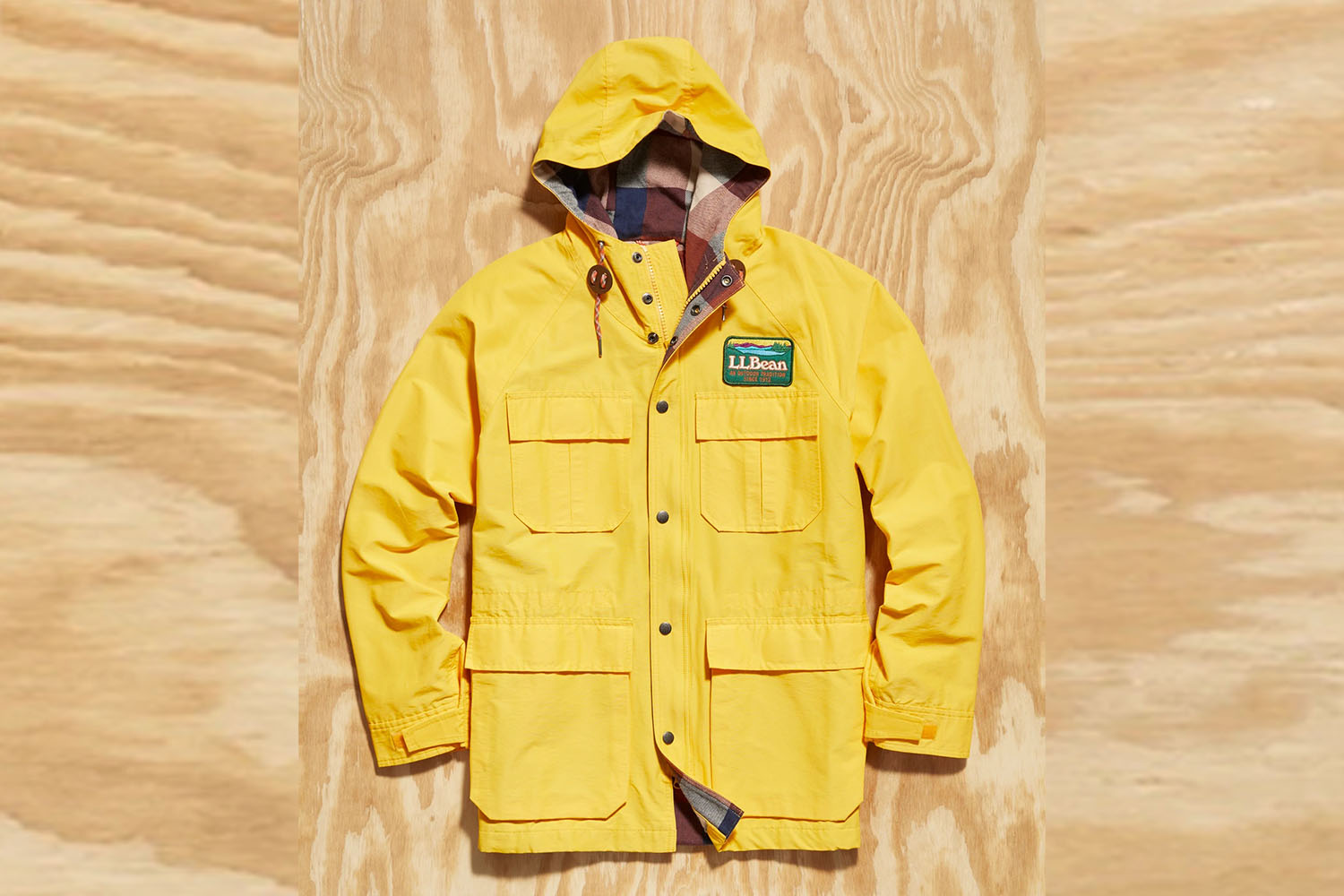 a Todd Snyder x L.L. Bean Parka on a wooden background