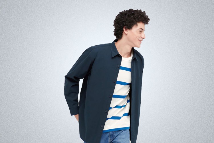a model wearing Uniqlo x J.W. Anderson Clothing on a grey background