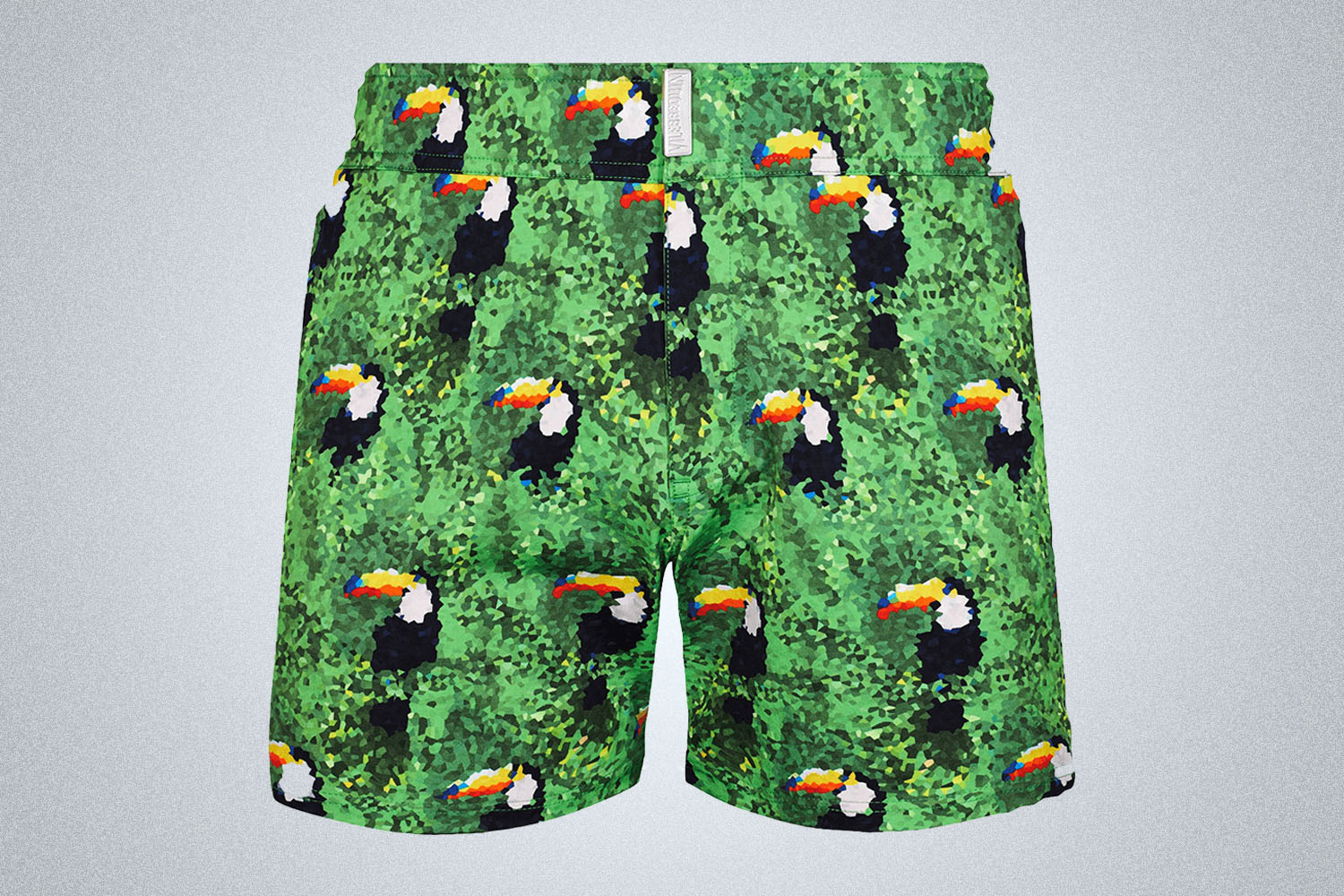 a green swim trunk with toucans from Vilebrequin on a grey background 
