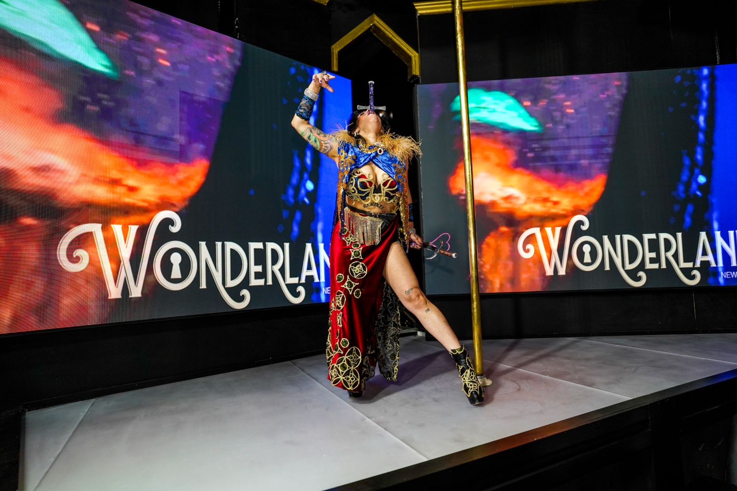 La Reine The Thrill Making Sword Swallowing Look Easy on Stage at Wonderland in NYC