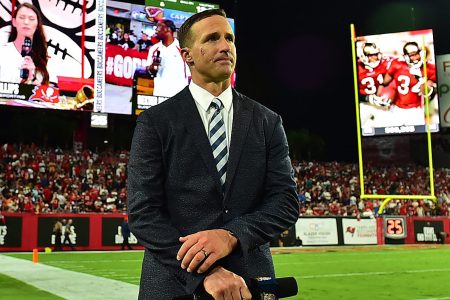 Drew Brees stands on the sideline during a game between the Buccaneers and the Cowboys