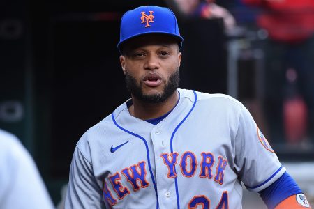 Former Met Robinson Cano looks on against the St. Louis Cardinals. 