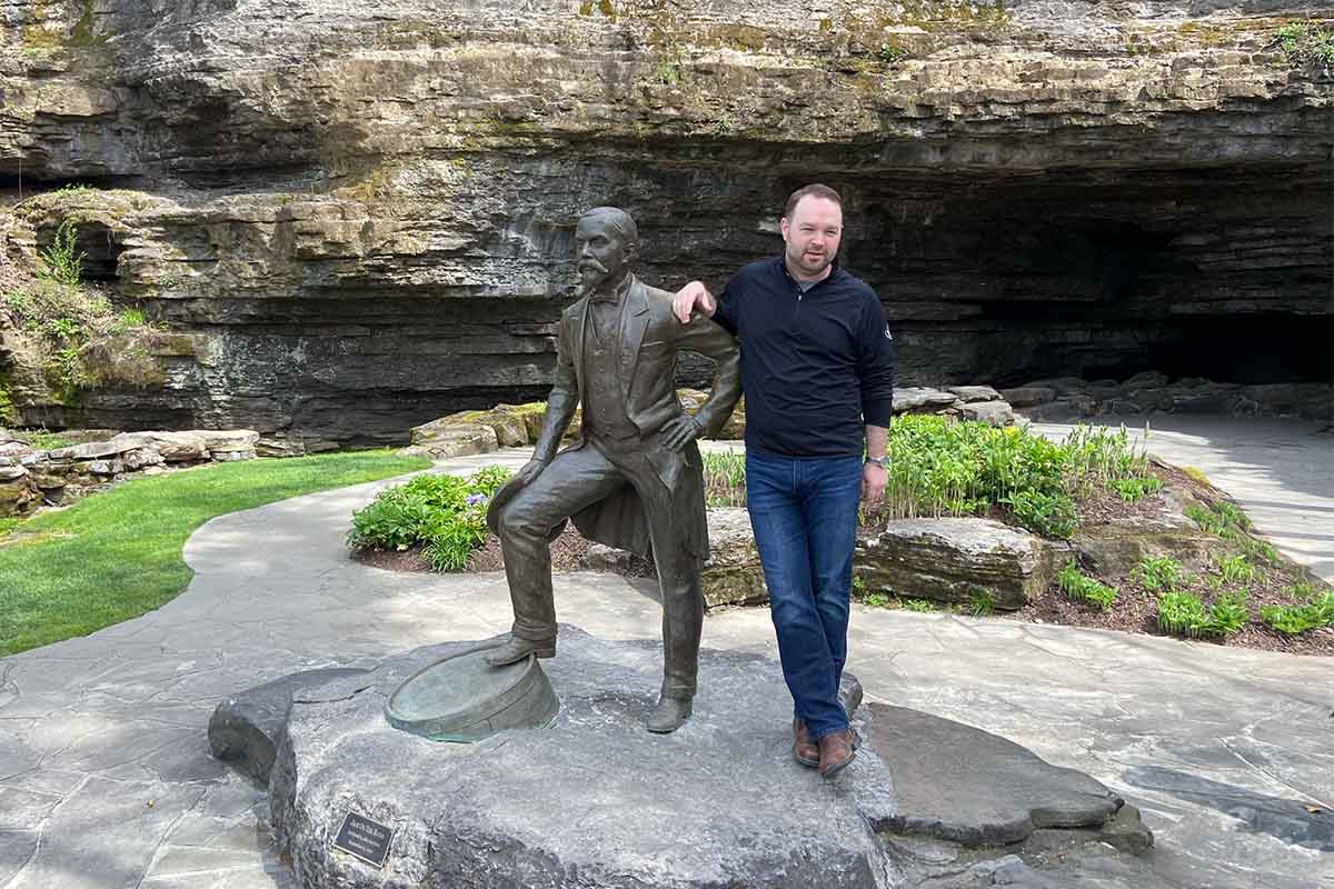 Jack Daniel's Master Distiller Chris Fletcher and the statue of Jack Daniel