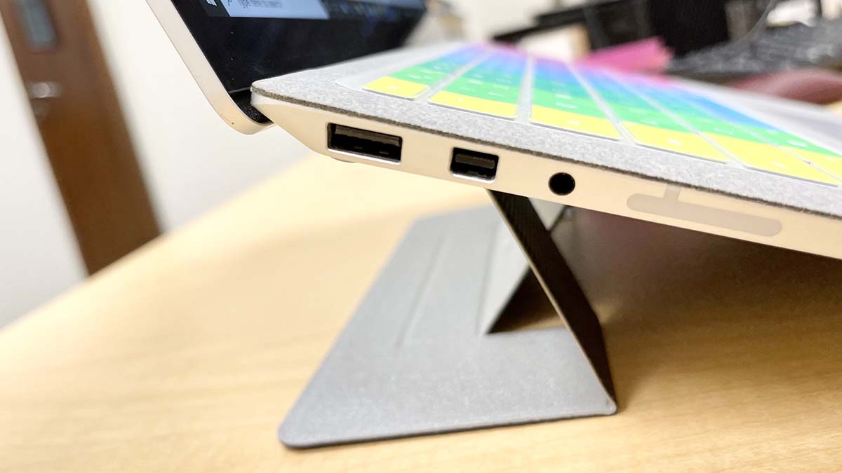 A close-up of the MOFT Invisible Laptop Stand on a computer