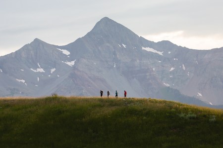 Four people hiking in Telluride, Colorado, as part of the Reset trekking retreat. We take a look at the wellness and luxury travel program, which opened in May 2022.