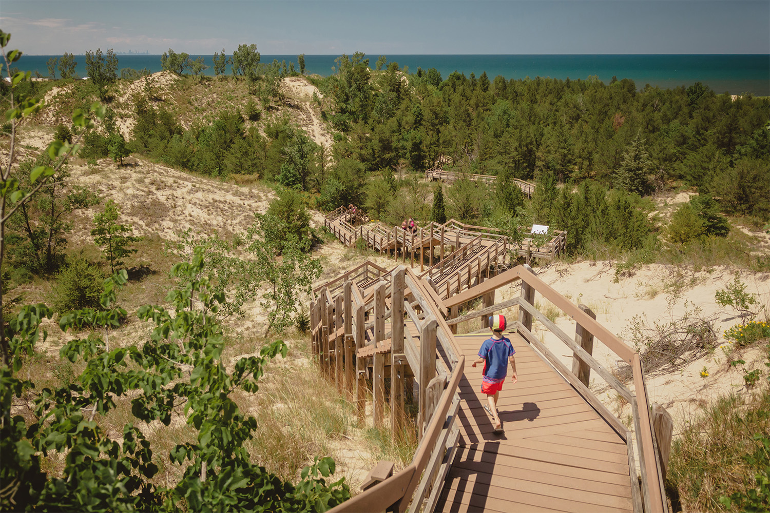 Boy hiking along dune succession trail in Indiana Dunes National Park.