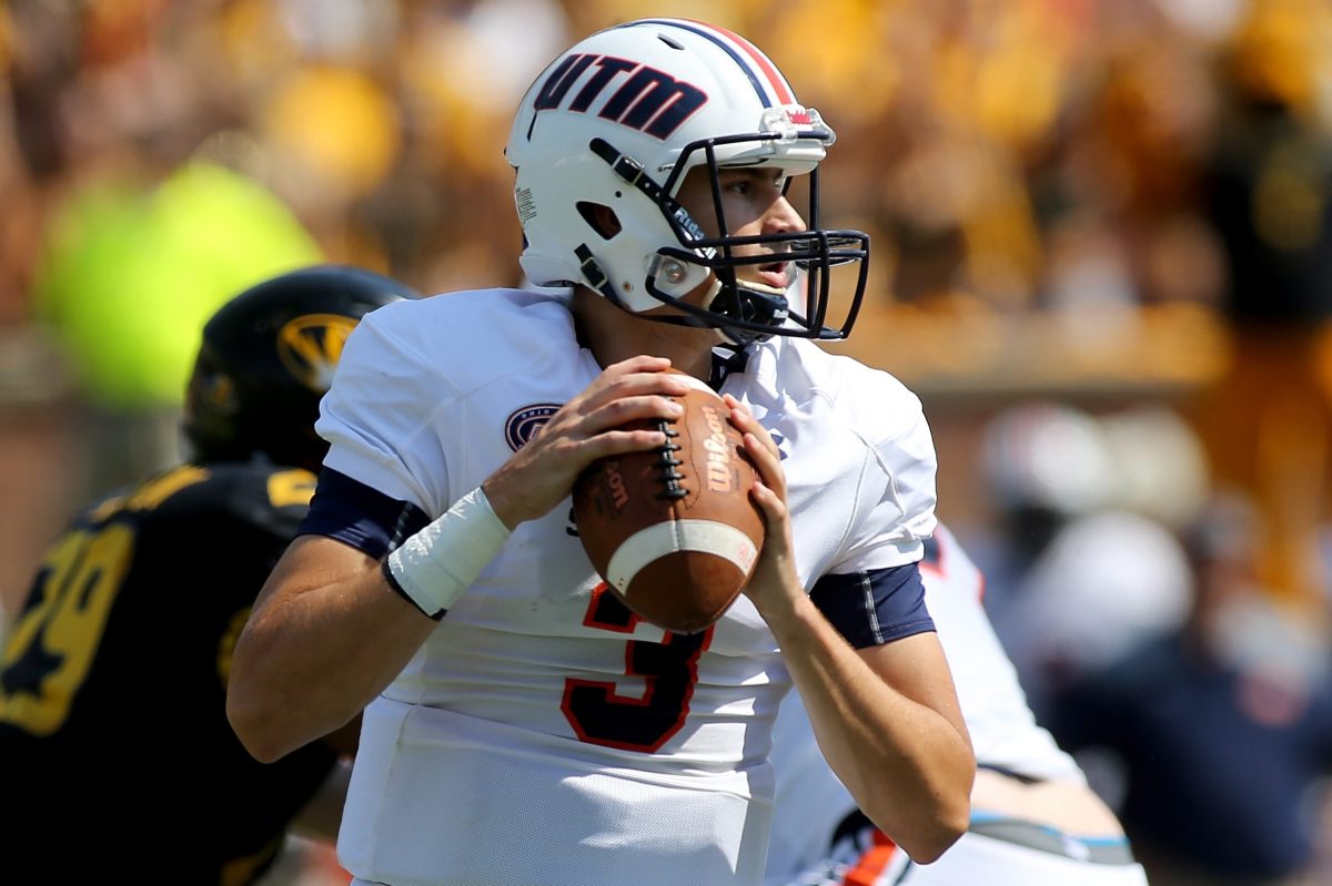 Tennessee-Martin quarterback Dresser Winn looks to pass the ball. Winn signed the first-ever name, image and likeness deal to support a political candidate.