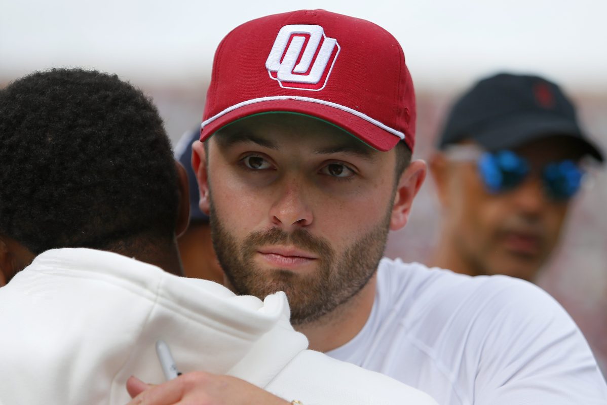 Ex-Oklahoma Sooners quarterback Baker Mayfield greets a former player