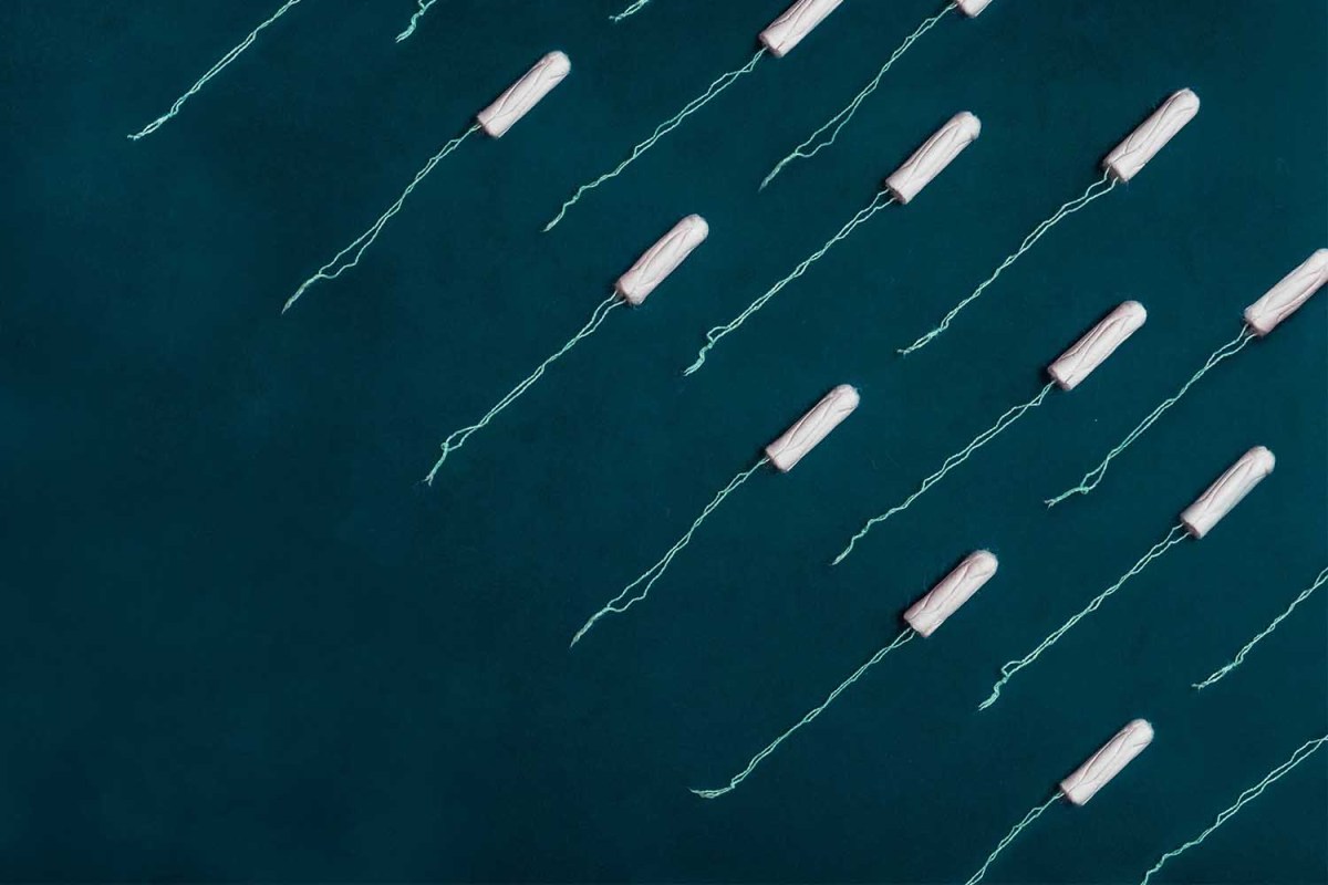 A photo illustration of tampons. We look into the issue of companies potentially offering universal menstrual leave.