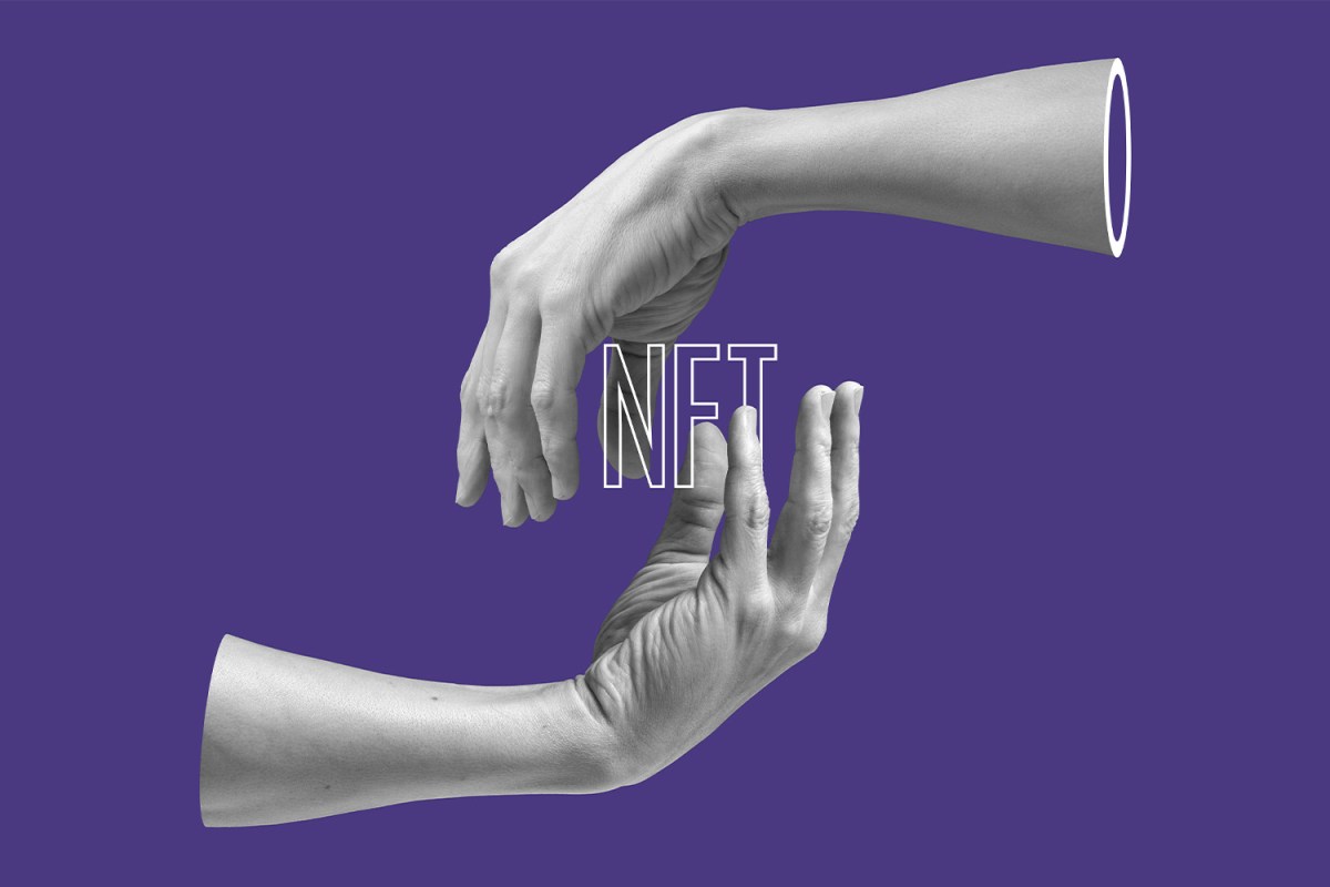 hands holding the word NFT on purple background