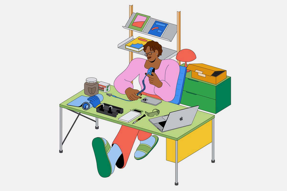 A cartoon drawing of a woman at a desk fixing her iPhone
