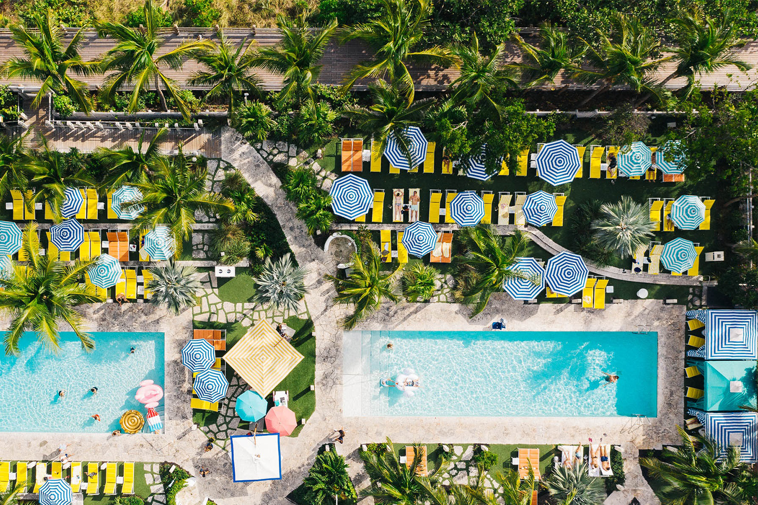 A bird's-eye view of the pools at The Confidante Miami Beach, an affordable but chic oceanfront hotel