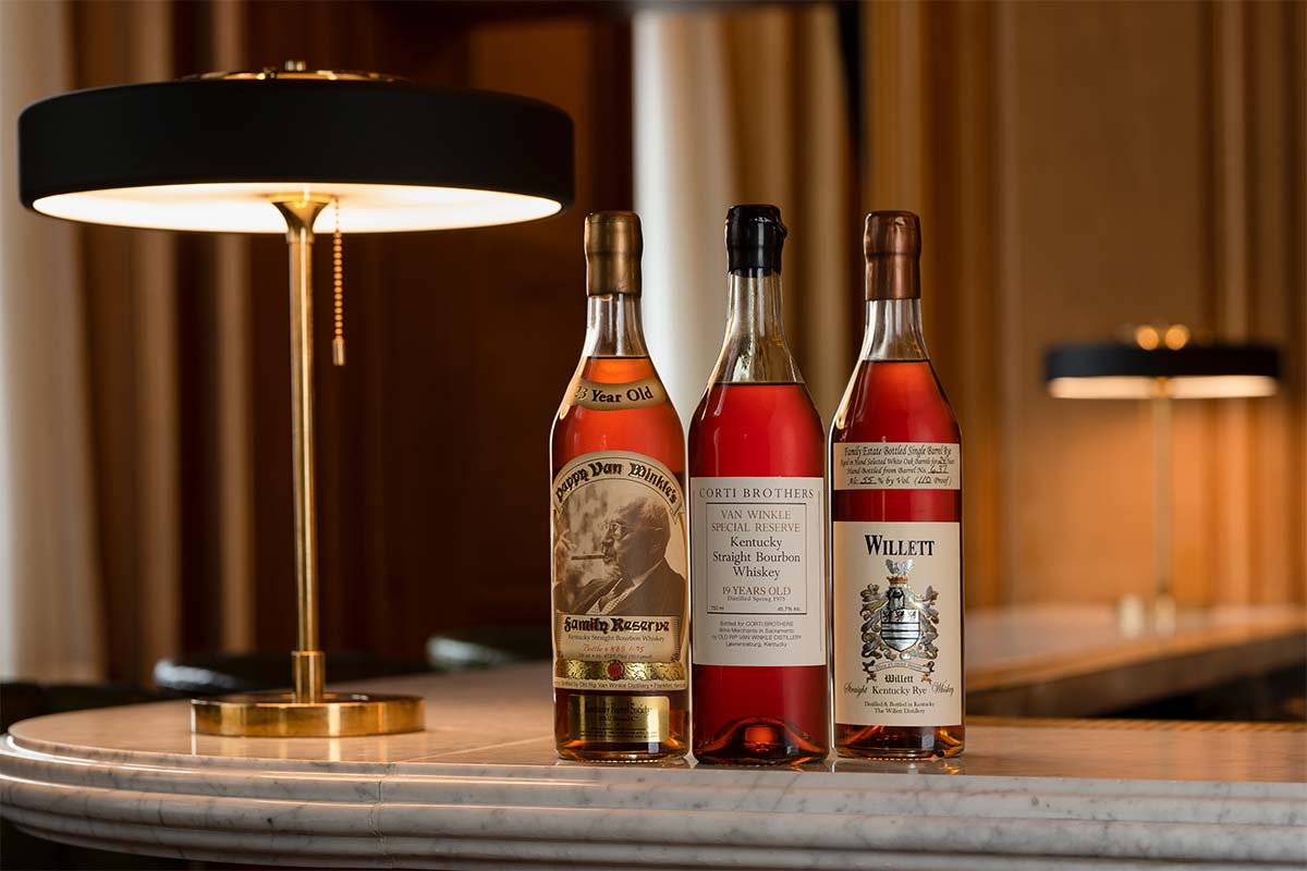 Hero bottles from the upcoming auction (L-R, Pappy Van Winkle 1984 23 YO / Kentucky Barrel Society, Van Winkle 1975 Special Reserve 19 Year Old for Corti Brothers, Willett Family Estate 1984 Single Barrel 24 YO Bourbon / Bonili )