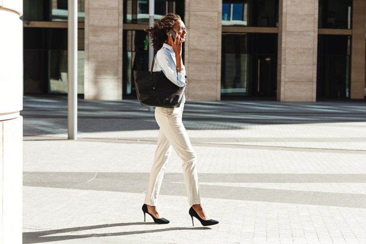 Photo of a businesswoman walking in heels