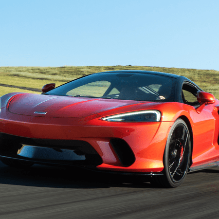 An orange 2022 McLaren GT, which is currently being given away by Omaze. Here's why "the golfer's supercar" is the supercar you should want.
