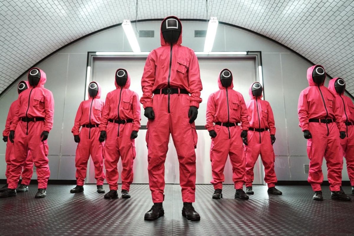 Guards dressed in pink in a scene from Netflix's Squid Game