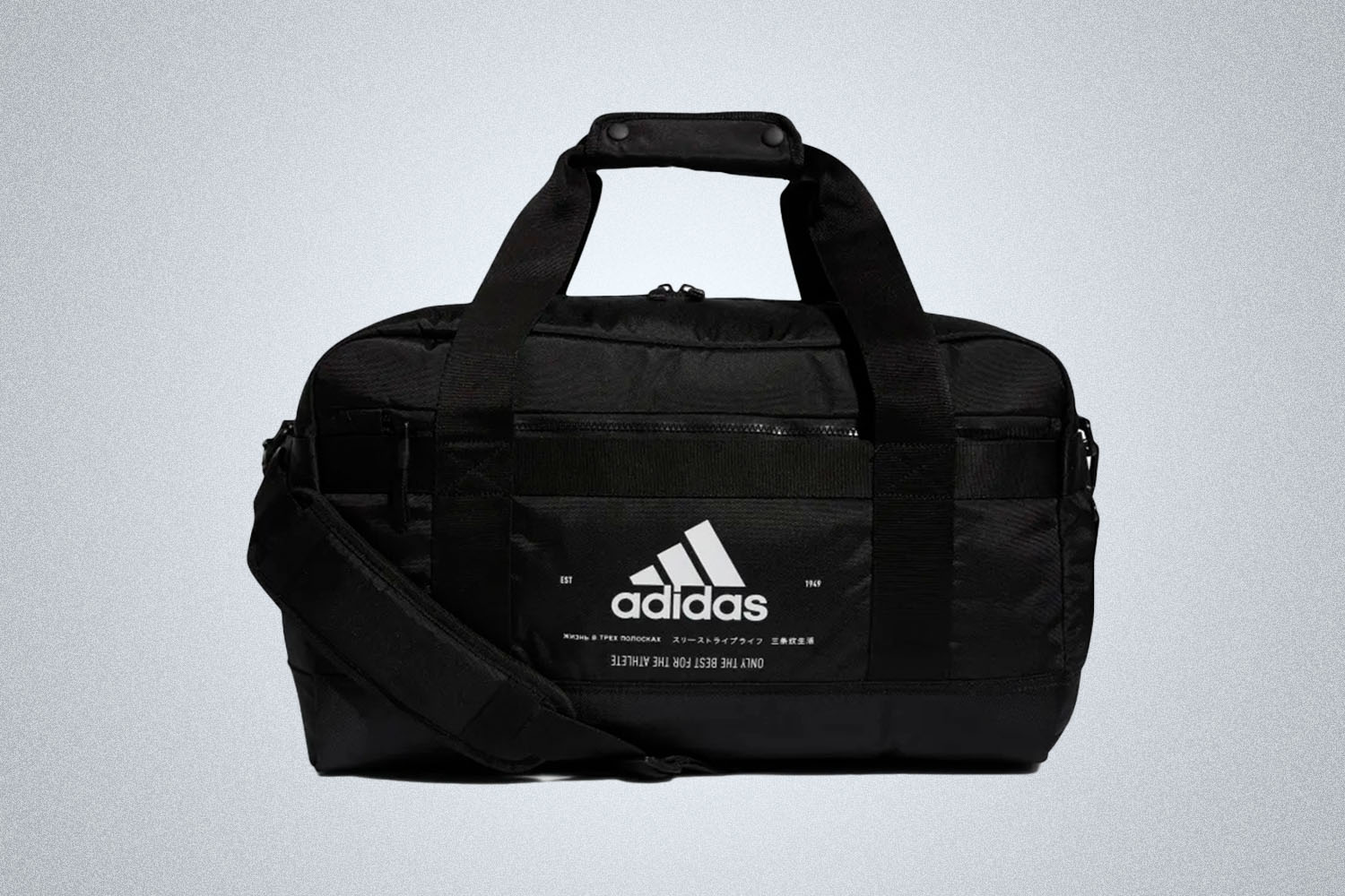 a black duffle bag from Adidas on a grey background