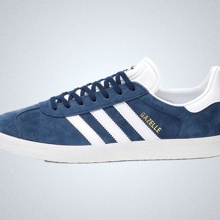 a blue and white-detailed sneaker from Adidas on a grey background
