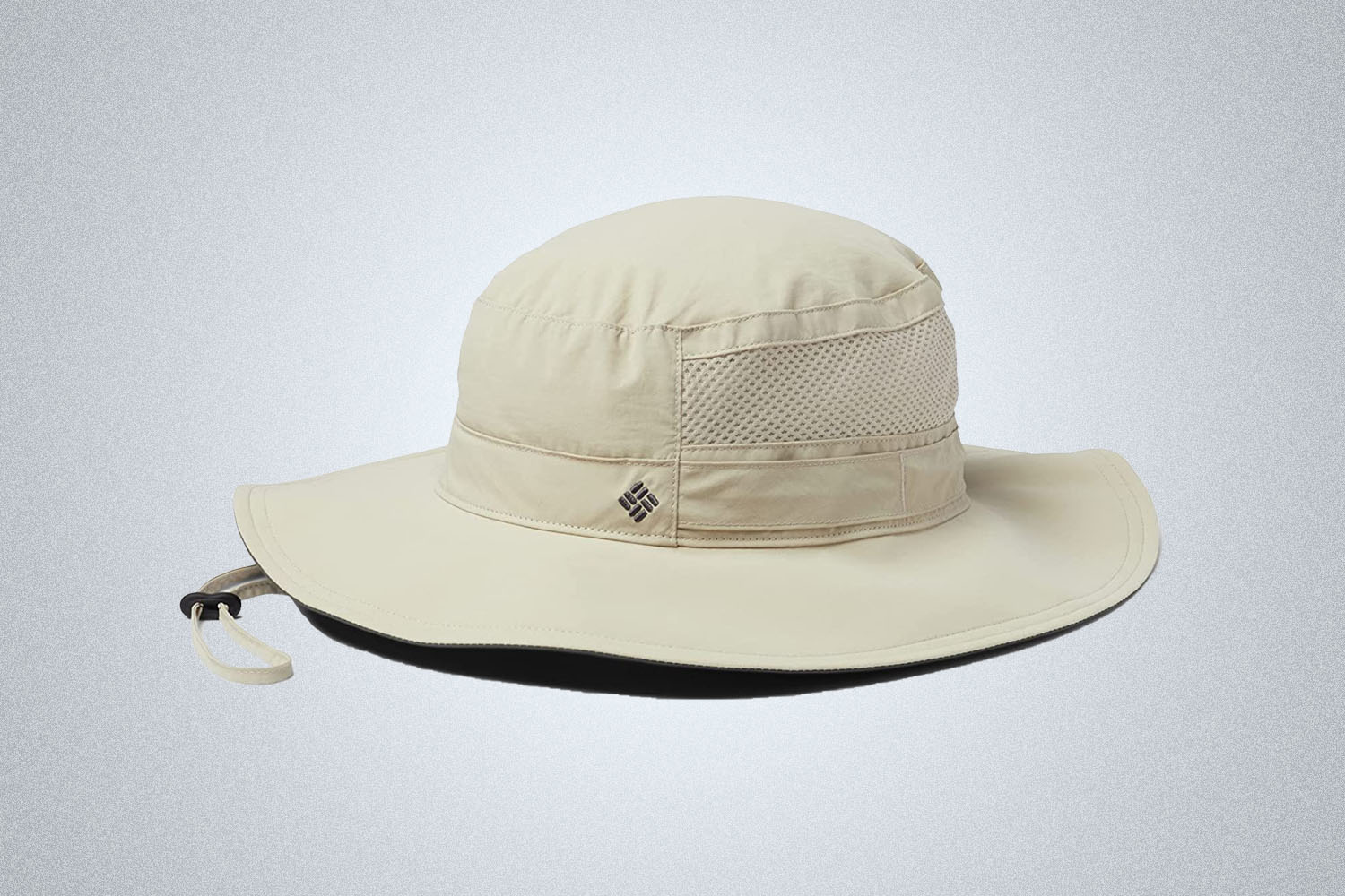 a white round brim hat from Columbia on a grey background
