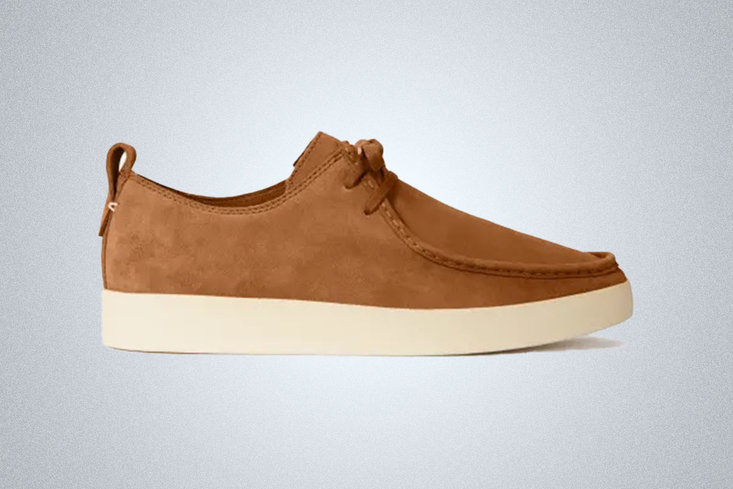 a beige Desert Shoe from Everlane on a grey background