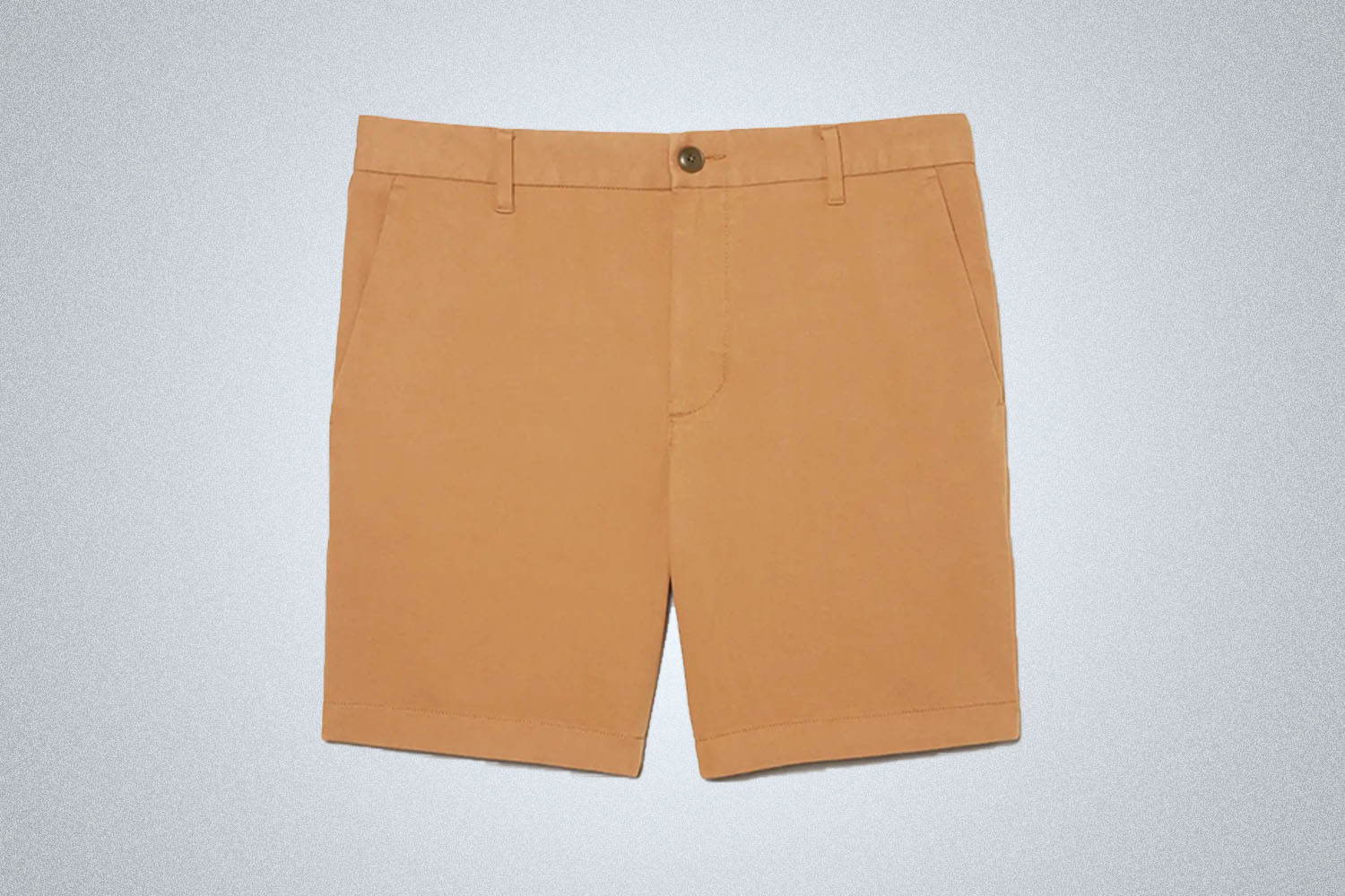 a pair of khaki 7" chino shorts from Everlane on a grey background
