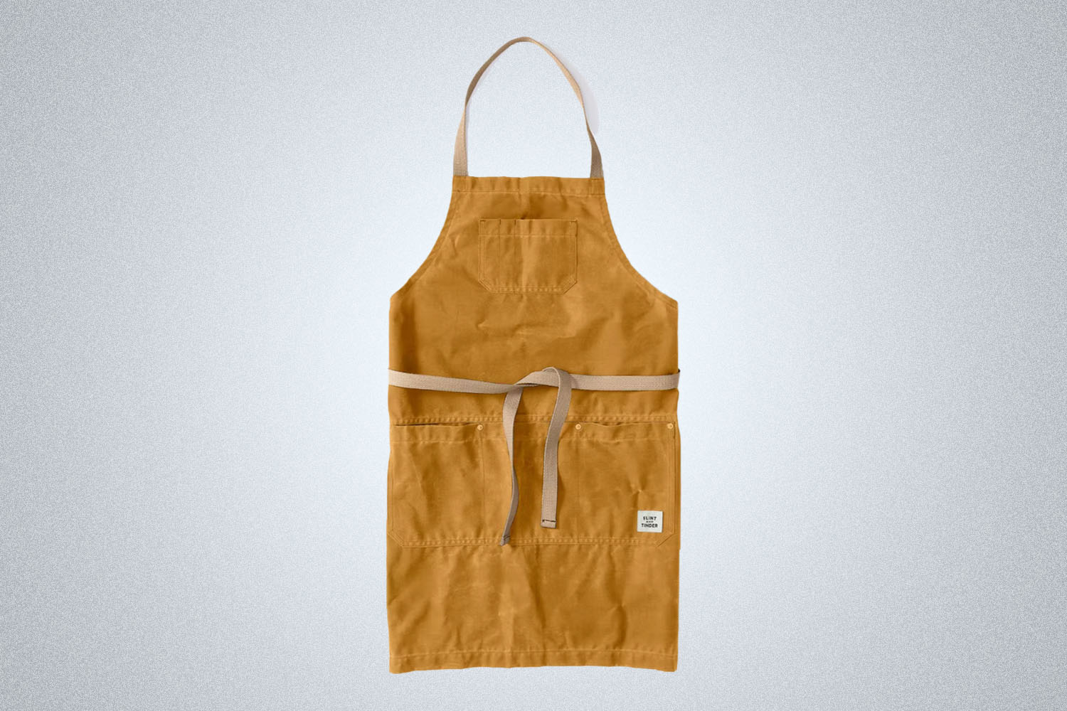 a beige Flint and Tinder apron