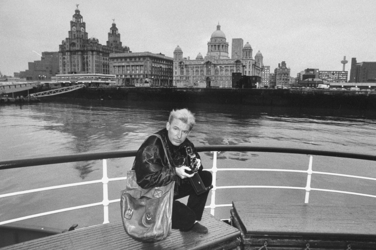 Mike McCartney, brother of Paul McCartney, on ferry on the Mersey shooting pictures with Rollei camera Paul bought him in 1962.