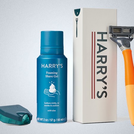 a collage of good from the Harry's Starter Kit on a grey background, inlcuding a razor, cover, shaving cream and box