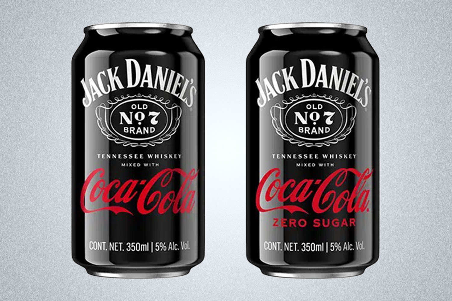 Two cans of Coke x Jack Daniel's canned cocktail on a gray background