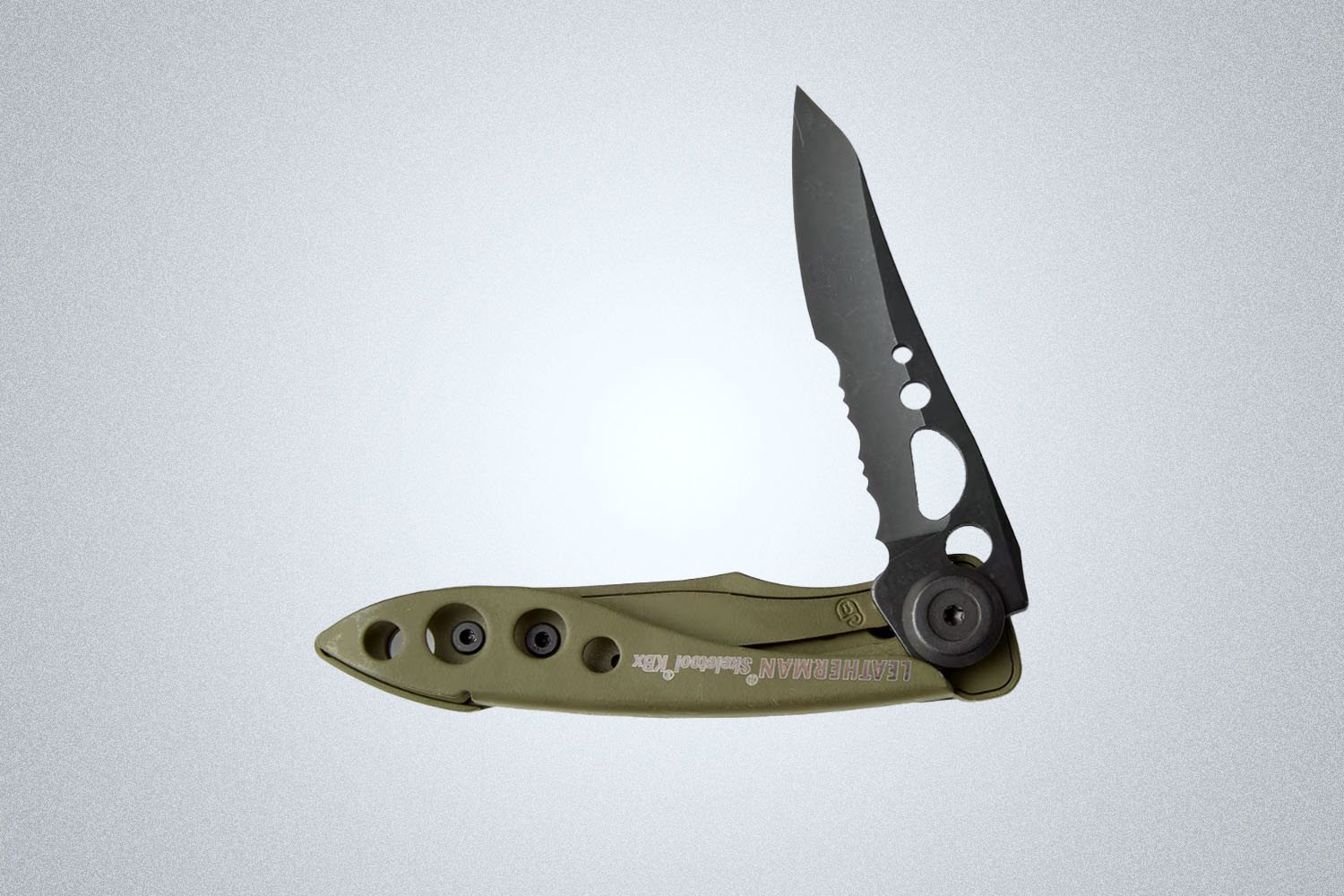 a green-hilted, black bladed knife from Leatherman on a grey background
