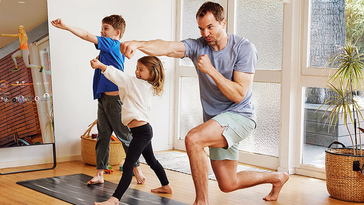a dad and two children working out in lululemomo apparel