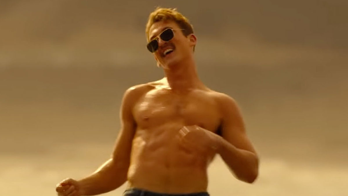a picture of Miles Teller in Top Gun:Maverick shirtless, dancing and wearing the Ray-Ban Caravan sunglasses