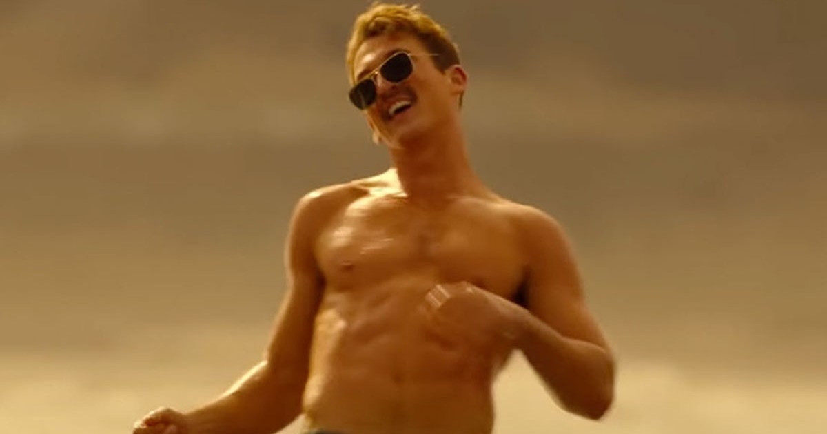 a picture of Miles Teller in Top Gun:Maverick shirtless, dancing and wearing the Ray-Ban Caravan sunglasses