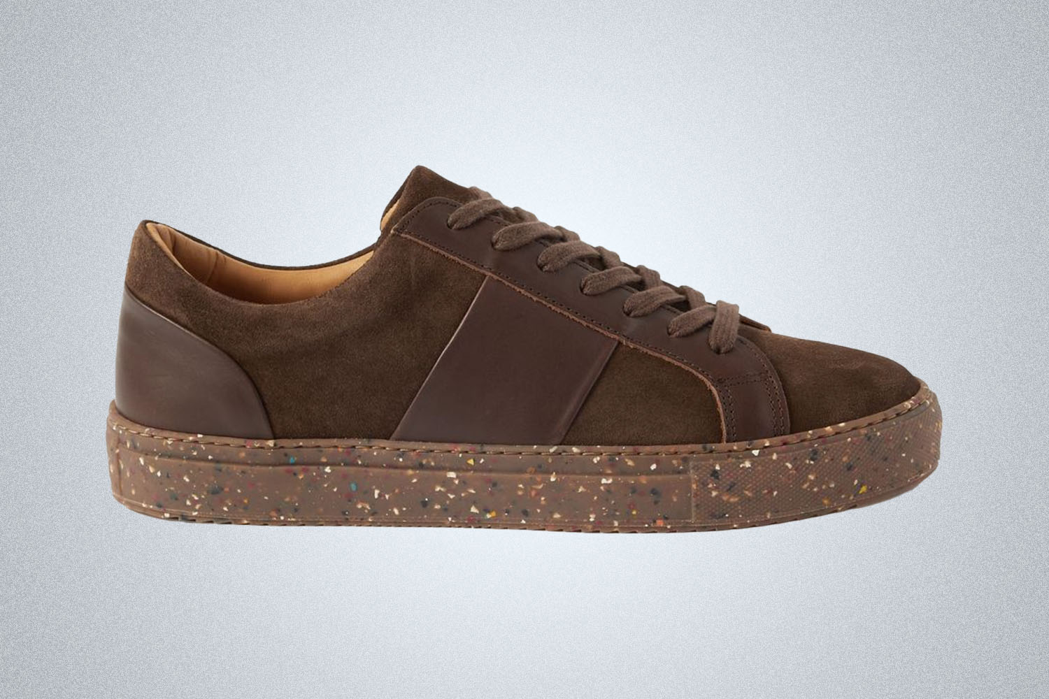 a brown suede sneaker from Mr P on a grey background