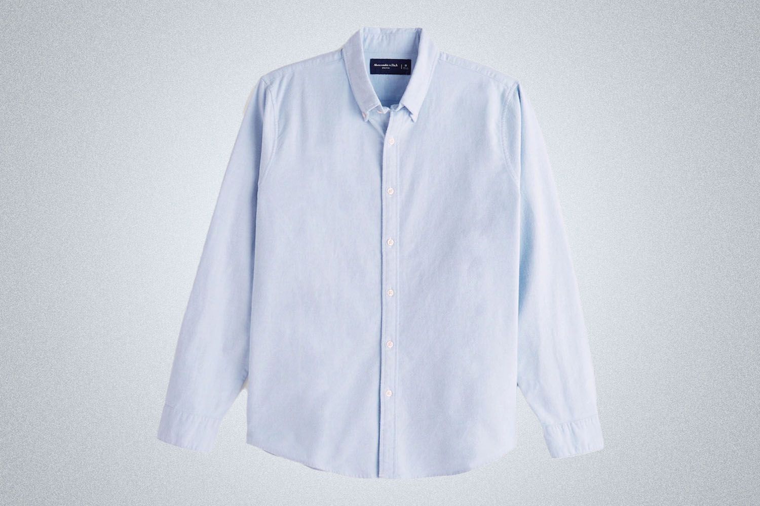 a light blue summery Abercrombie & Fitch shirt on a grey background