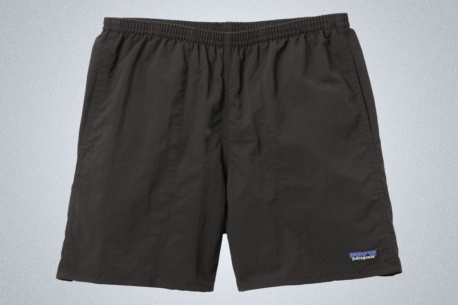 a pair of black Patagonia Baggies on a grey background