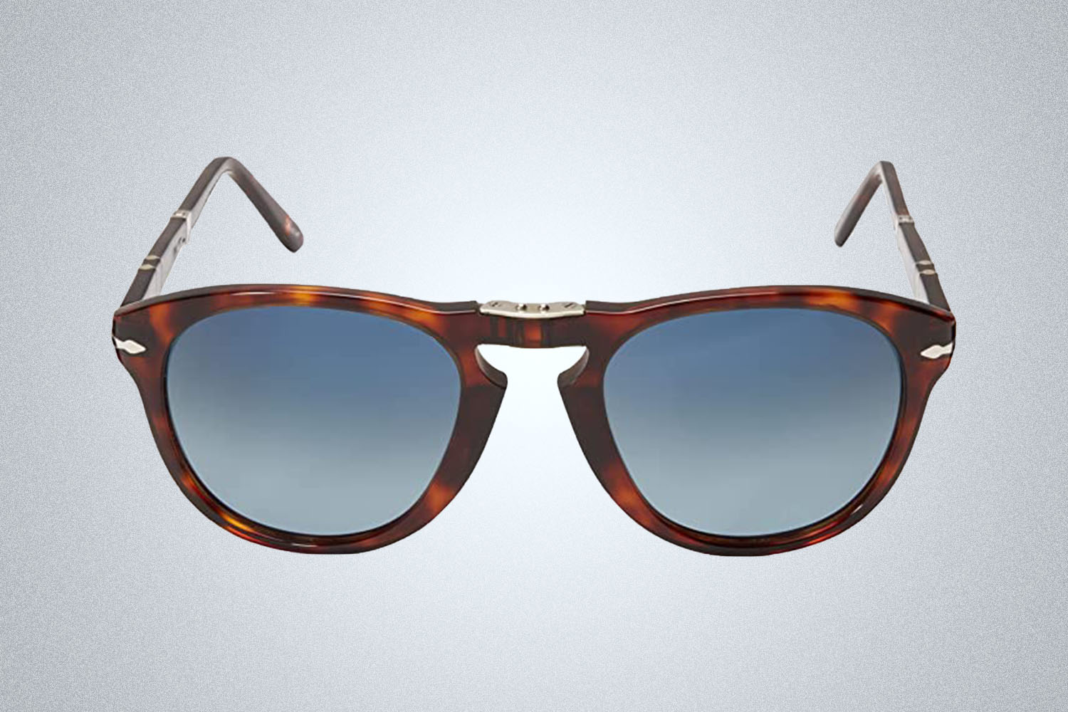 a pair of Persol sunglasses from Amazon on a grey background