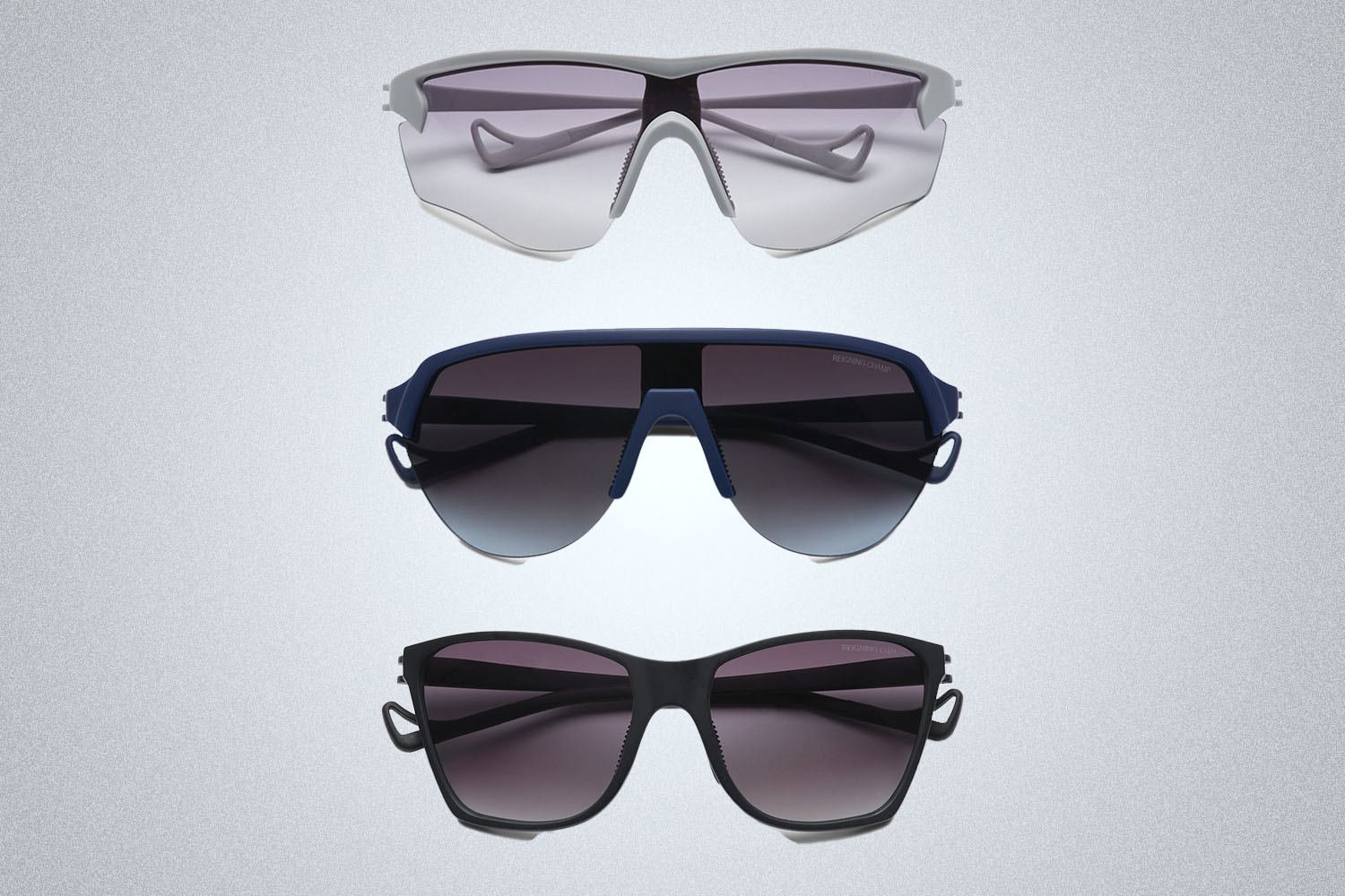 three pairs of Reigning Champ x District Vision sunglasses in a vertical column on a light grey background