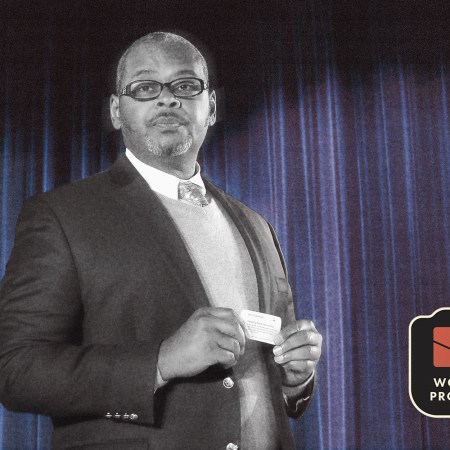 Ron Simons, the Broadway and movie producer of SimonSays Entertainment, standing in front of a curtain. We spoke with him ahead of the 75th Annual Tony Awards in 2022 to talk about the racial reckoning on Broadway, his groundbreaking plays and the future of Black artists in the theater.