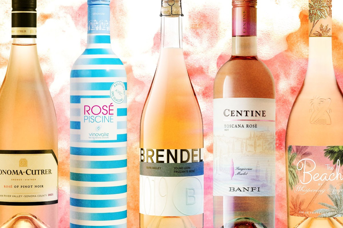 Five bottles of rosé displayed on a light pink background