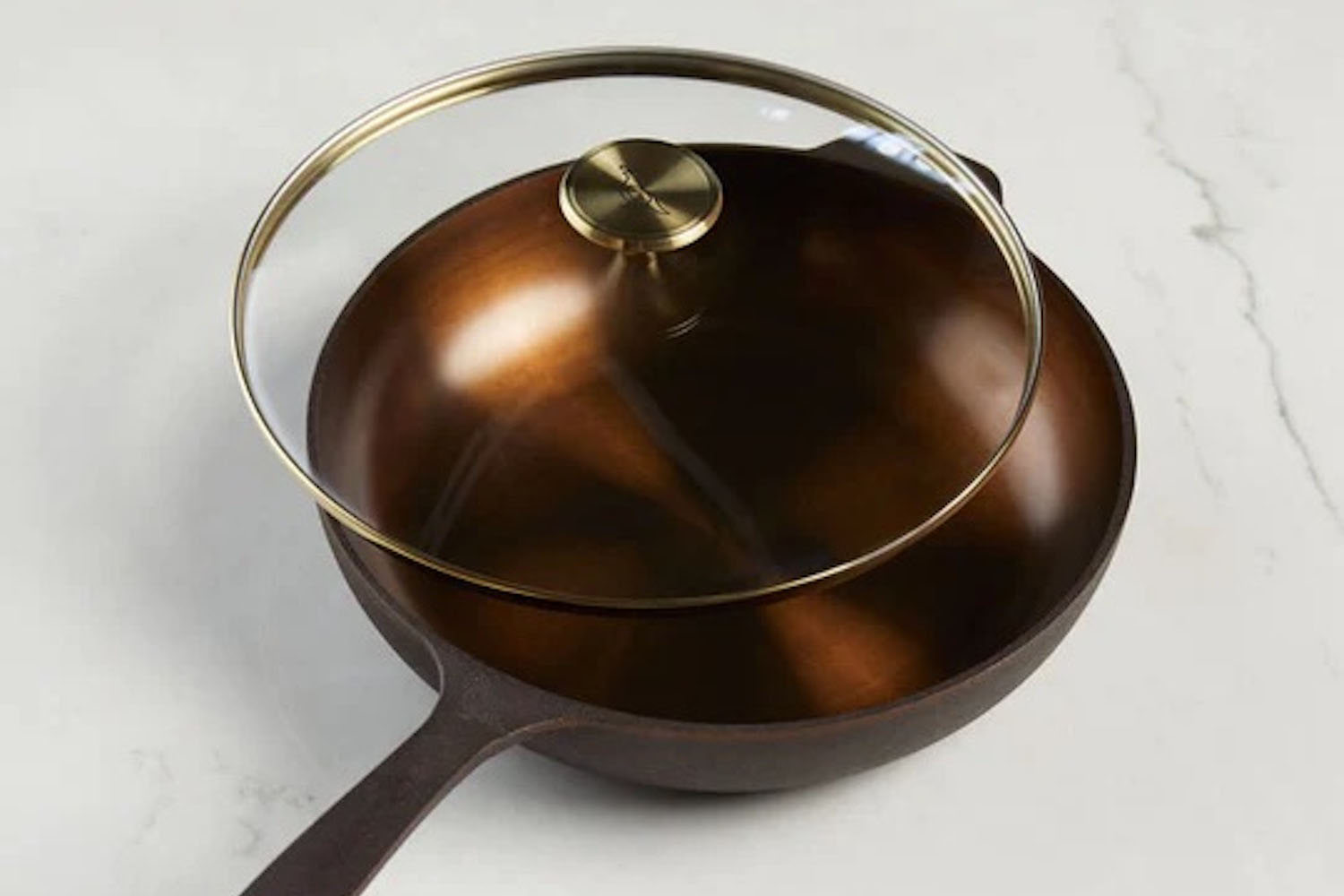 a product shot of a cast iron Smithey Skillet and Glass Lid