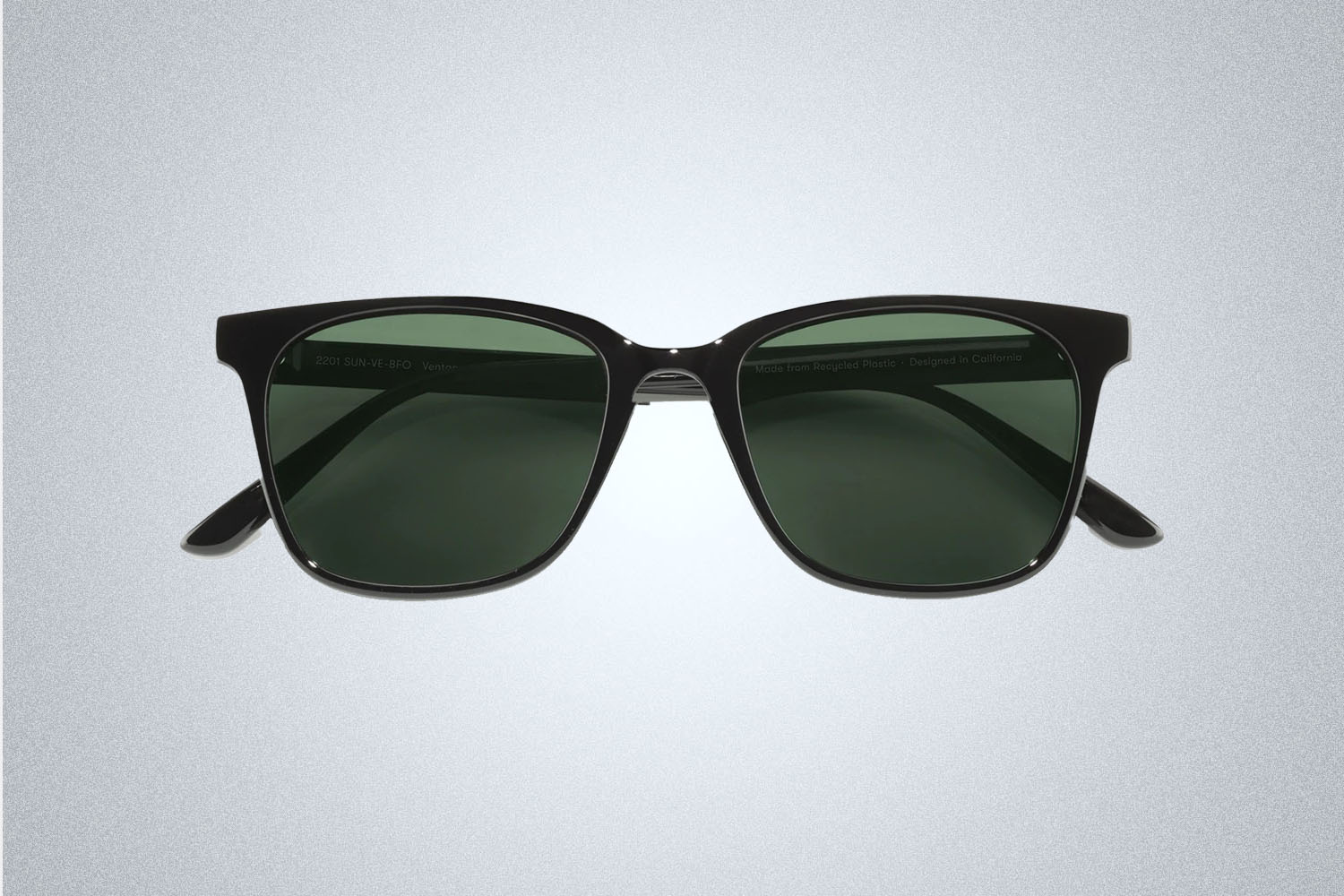 A pair of square black sunglasses from Sunski on a grey background