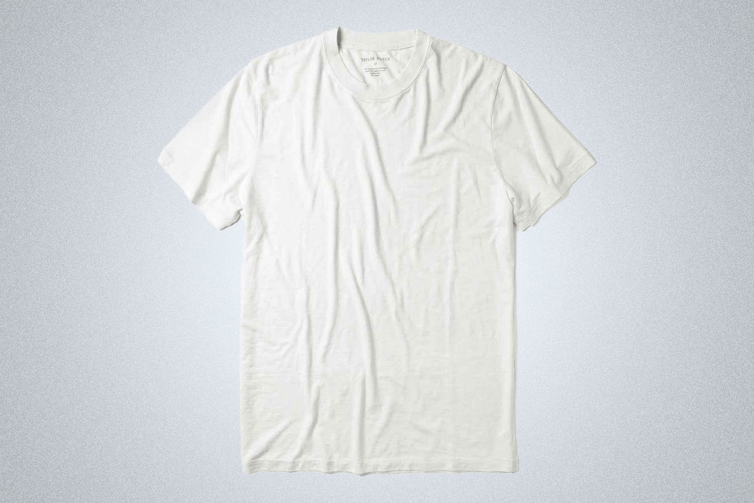 a white cotton-hemp short sleeve tee shirt from Taylor Stitch on a grey background