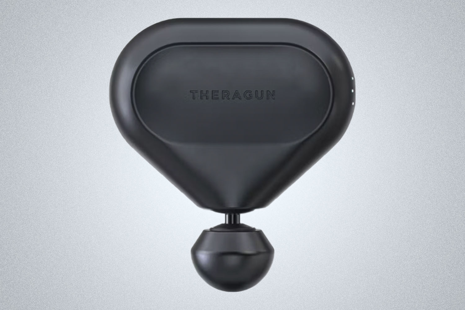a black percussive massive tool from Therabody on a grey background