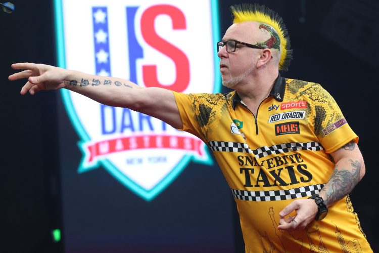 Peter Wright throws a dart in the opening round of the PDC Darts Championships.